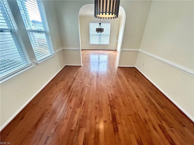 unfurnished dining area featuring hardwood / wood-style floors