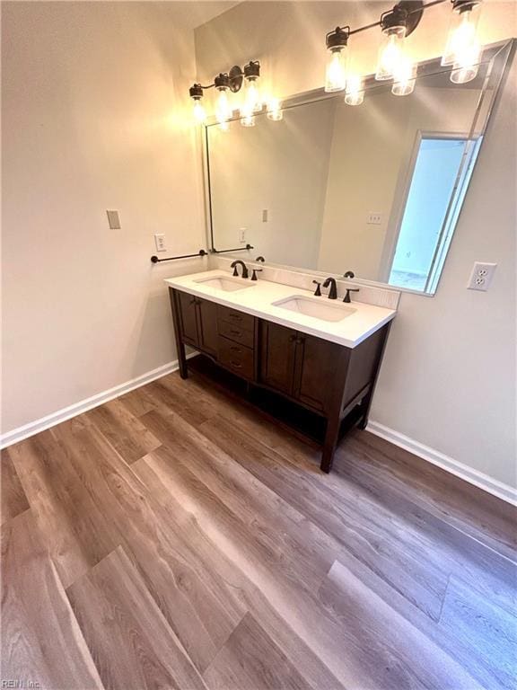 bathroom featuring hardwood / wood-style floors and vanity