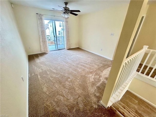 carpeted empty room with ceiling fan