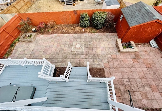 view of patio with a storage unit