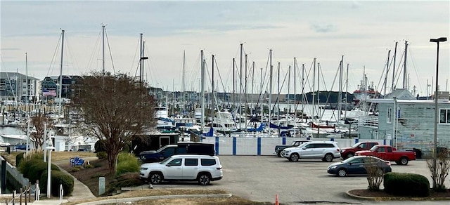 view of vehicle parking with a water view