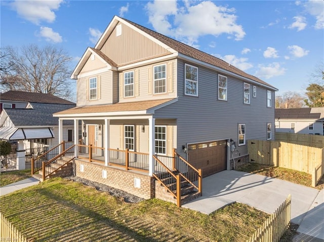 exterior space featuring a garage, a front yard, and covered porch