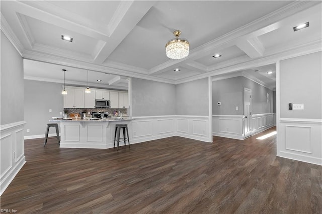 unfurnished living room featuring crown molding, beamed ceiling, and coffered ceiling