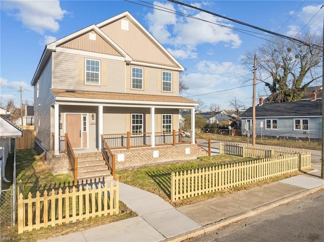 view of front facade with a front yard and a porch