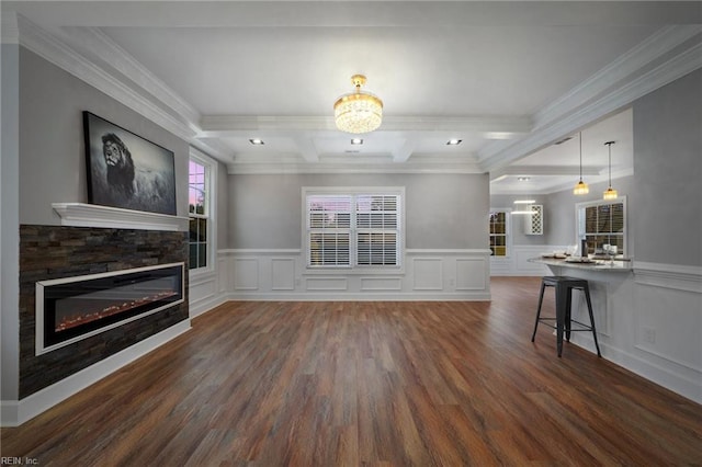 living room with beam ceiling, a fireplace, dark hardwood / wood-style floors, crown molding, and coffered ceiling