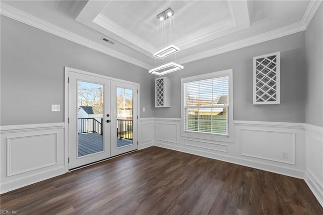 interior space with french doors, crown molding, dark wood-type flooring, and a tray ceiling