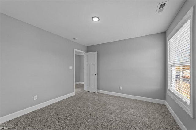 unfurnished room with carpet