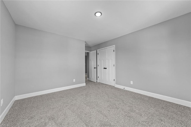 empty room featuring carpet flooring