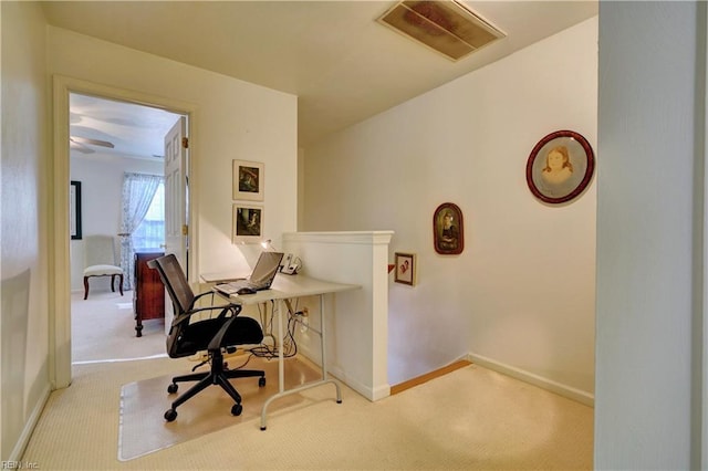 office area featuring light carpet