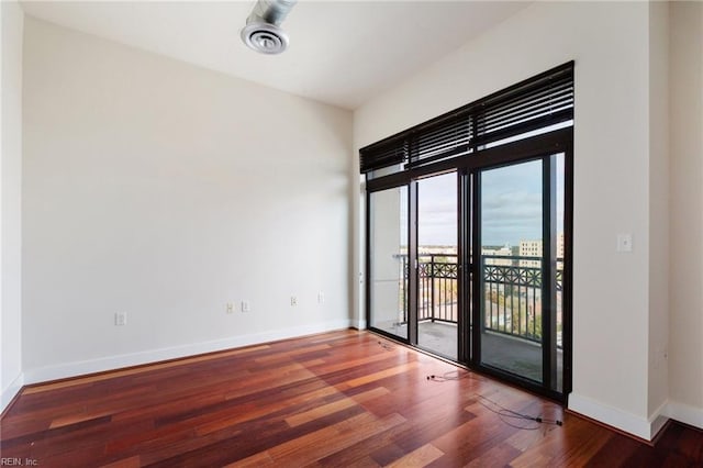 unfurnished room featuring wood-type flooring