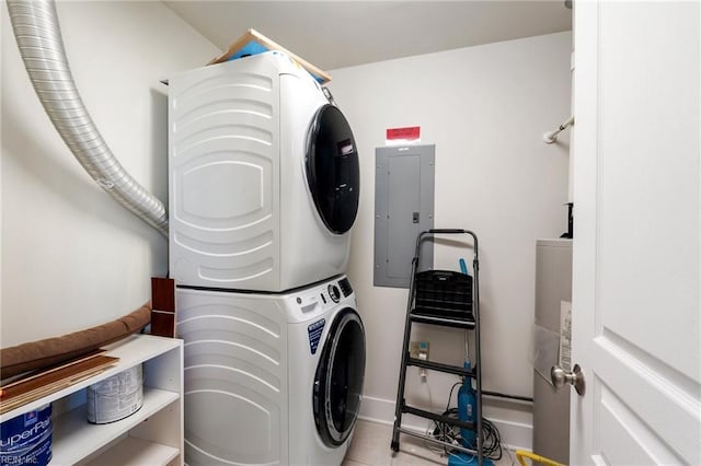 laundry area featuring stacked washer and dryer, light tile patterned flooring, and electric panel