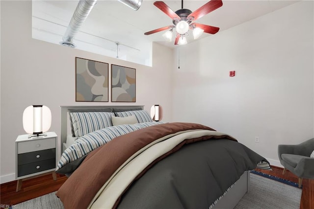 bedroom featuring hardwood / wood-style flooring and ceiling fan