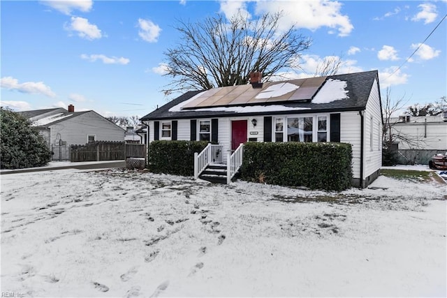 view of front of home featuring solar panels