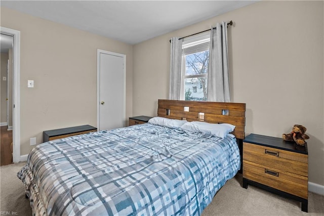 bedroom featuring light carpet