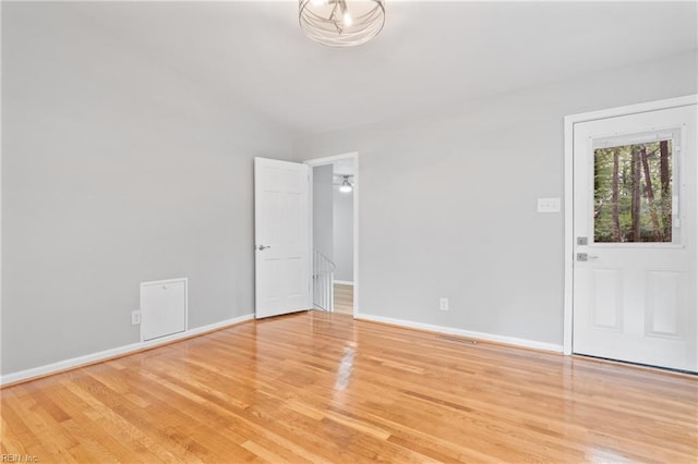 empty room with light wood-type flooring