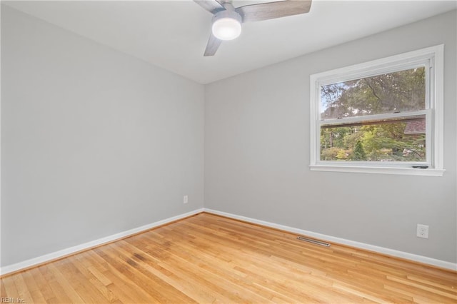 empty room with light wood-type flooring and ceiling fan