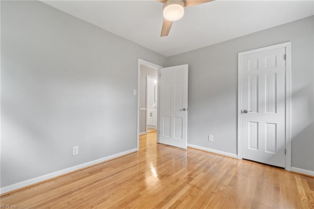 unfurnished bedroom featuring light wood-type flooring and ceiling fan