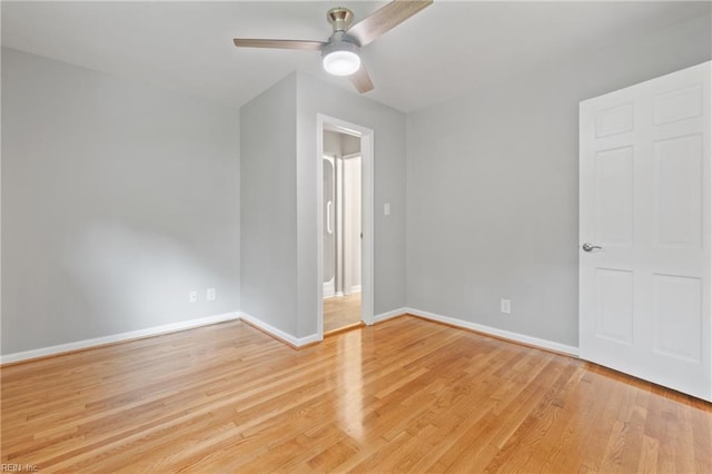 unfurnished room with light wood-type flooring and ceiling fan