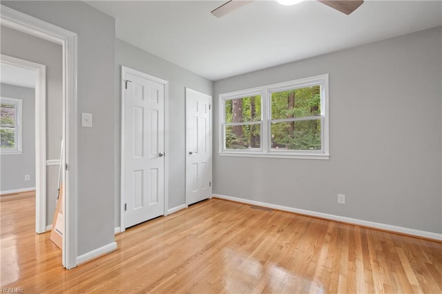 unfurnished bedroom with light hardwood / wood-style floors and ceiling fan