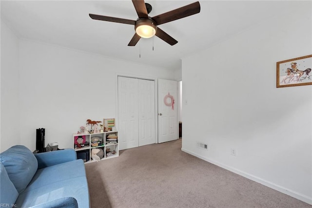 living room with carpet floors and ceiling fan