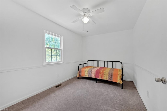 bedroom featuring ceiling fan and carpet flooring