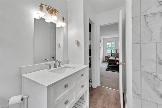 bathroom featuring hardwood / wood-style floors and vanity