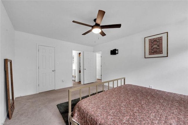 bedroom featuring ceiling fan, connected bathroom, and carpet floors