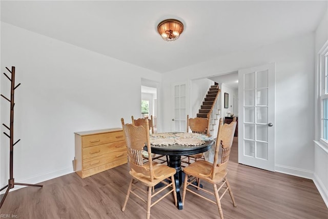 dining room with dark hardwood / wood-style floors