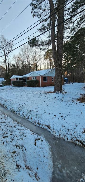 view of yard layered in snow