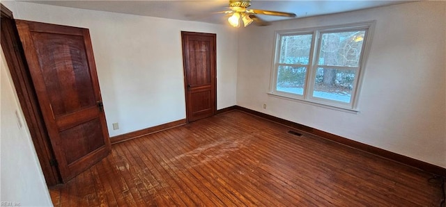 unfurnished bedroom with dark wood-type flooring and ceiling fan