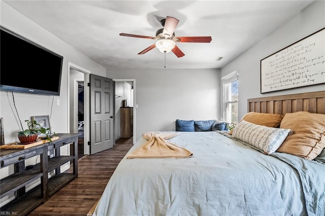 bedroom featuring ceiling fan and dark hardwood / wood-style floors