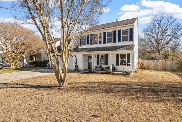 front facade featuring a garage, a front lawn, and a porch