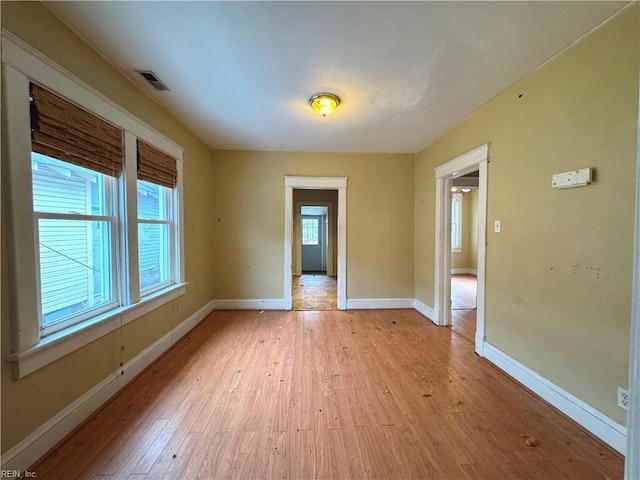 unfurnished room with light hardwood / wood-style flooring