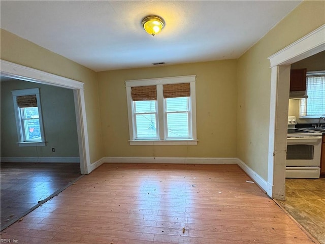 unfurnished dining area featuring light hardwood / wood-style floors