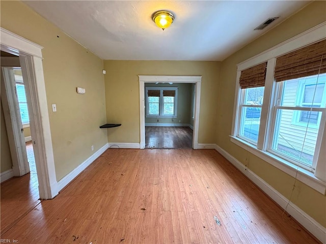 spare room with light wood-type flooring