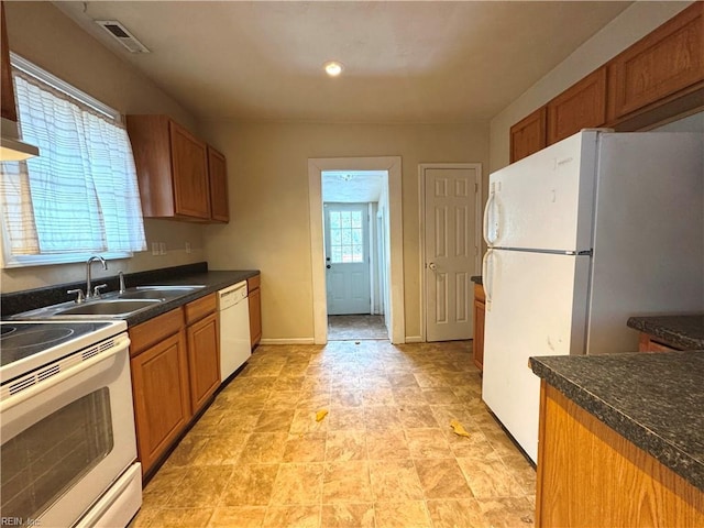 kitchen with white appliances and sink