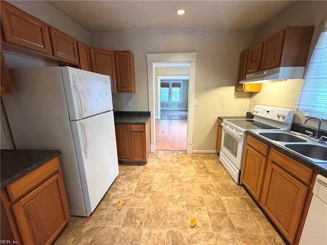 kitchen with white appliances and sink