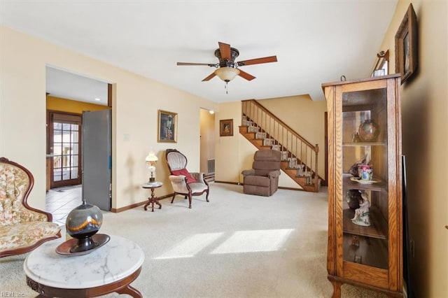 sitting room with light colored carpet and ceiling fan