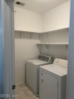 laundry room featuring washing machine and dryer