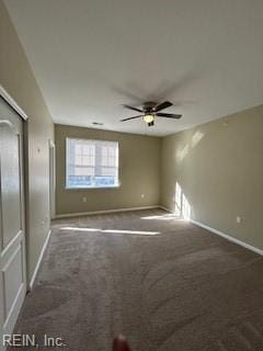 carpeted empty room with ceiling fan