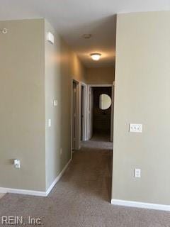 hallway with carpet