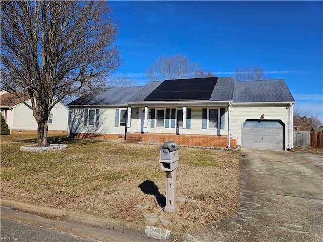 ranch-style house featuring a garage, a porch, a front lawn, and solar panels