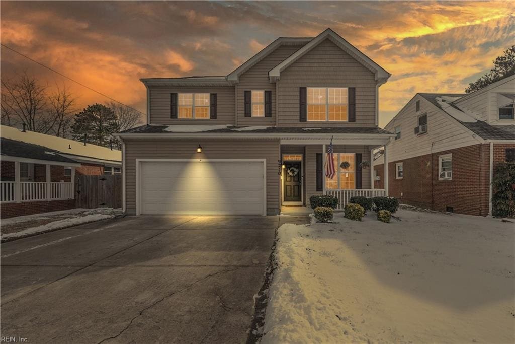 view of front of home with a garage and covered porch