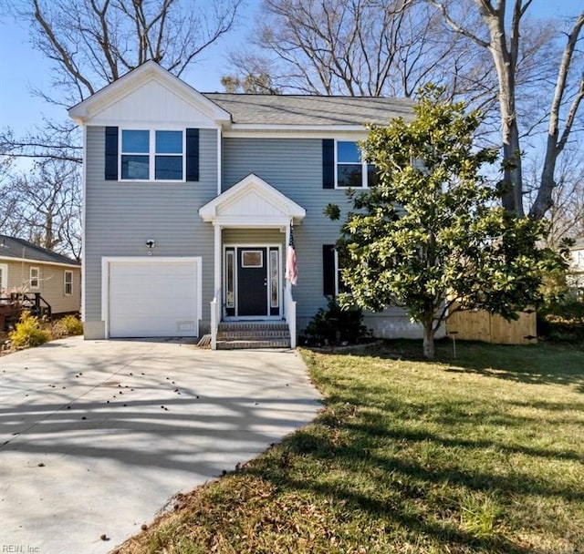 view of front of home featuring a garage and a front yard