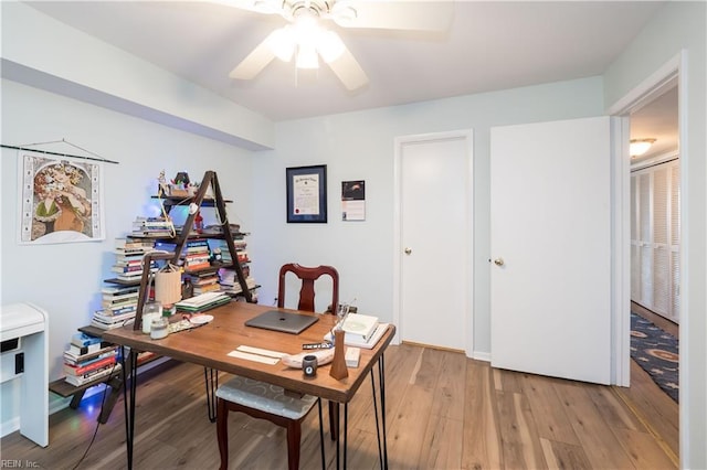 home office featuring ceiling fan and light wood-type flooring