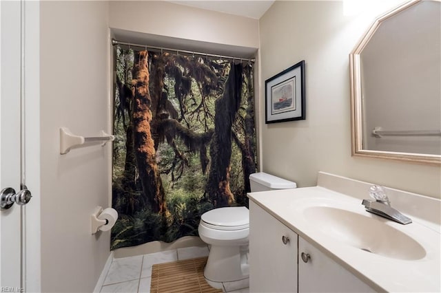 bathroom with vanity and toilet