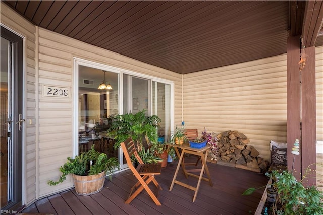 wooden deck featuring covered porch