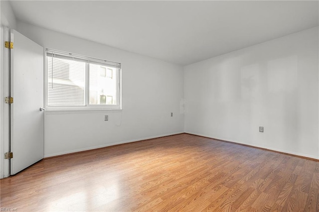 spare room featuring light hardwood / wood-style floors