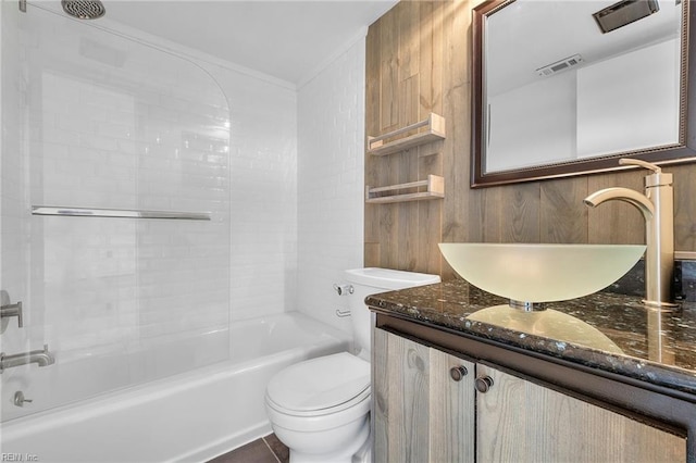 full bathroom featuring toilet, shower / washtub combination, wooden walls, and vanity