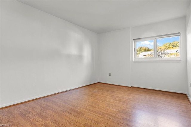 unfurnished room featuring light hardwood / wood-style floors